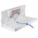 A white plastic baby changing table with a blue strap.