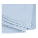 A close up of a stack of folded light blue Intedge table cloths.