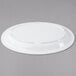 a white plate on a gray background