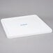 A white plastic Carlisle rack cover with blue writing.