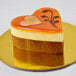 A heart shaped cake on a white plate.