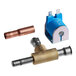 A Manitowoc Ice solenoid valve with copper pipes attached.