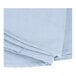 A stack of folded light blue Intedge round cloth table covers.