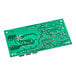 A green Manitowoc Ice circuit board with many small round holes.