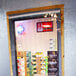 A room with a Curtron strip door showing boxes of beer through the window.