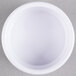 A white Carlisle ramekin on a gray surface.