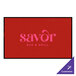 A white rectangular entrance mat with a red and white logo for Savor Bar and Grill.