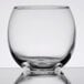 A close up of a clear Libbey glass votive candle holder.