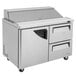 A Turbo Air stainless steel commercial refrigerated sandwich prep table with 2 drawers on wheels.