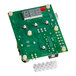 A green circuit board with white buttons and wires.