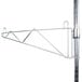 A Metro stainless steel wall mount shelf support pole with a metal rod.