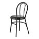 A black Lancaster Table & Seating Hairpin Chair with black vinyl seat.