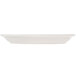 An ivory narrow rim oval china platter on a white surface.