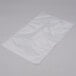 A clear plastic bag on a white surface.