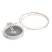 A white circular electric heater with a wire.