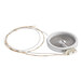 A circular white heater with a circular object in the middle and wires.