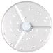 A circular metal food processor disc with holes in it.
