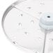 A Robot Coupe 1/8" grating/shredding disc with holes in it.
