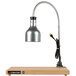 A Cres Cor portable carving station with a silver lamp on a wood surface.