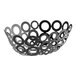 An American Metalcraft black metal oval basket with circles on it.