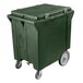 A green plastic container with wheels.