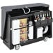 A black Cambro portable bar set up with bottles and containers.