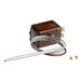 A brown Vulcan thermostat with metal wires and screws.