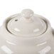 A white ceramic Hall China teapot lid.