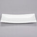 A CAC Tokyia bone white rectangular porcelain platter with long edges.