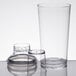 A Tablecraft clear plastic cobbler cocktail shaker with a glass cup.