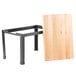 A Tablecraft butcher block riser with a black metal frame.