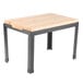A Tablecraft butcher block riser with black metal legs on a wood table.