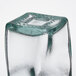 A Tablecraft recycled green tint glass salt and pepper shaker with a square shape on top.