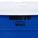 A blue Rubbermaid BRUTE recycling can with a white lid.
