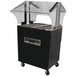 A black and silver Advance Tabco hot food table with a clear cover.