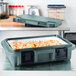 A Cambro Ultra Pan Carrier with food inside.