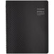 A black weekly planner with a carbon fiber pattern on the cover.