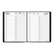 A spiral bound black At-A-Glance planner with white pages.