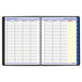 A white background with a black At-A-Glance spiral-bound planner open to a yellow-lined calendar page.
