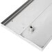 A stainless steel Advance Tabco bar drink rail.