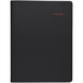 A black At-A-Glance appointment book with white trim and red writing on the cover.