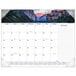 An At-A-Glance desk pad calendar with a picture of mountains and a sunset.