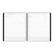 A black spiral bound At-A-Glance monthly planner with white lined pages.