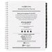 A white spiral bound At-A-Glance weekly planner with black text.