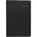 A black notebook with gold text on the cover.