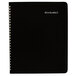 A black At-A-Glance spiral-bound monthly planner with silver spirals.