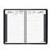 A spiral bound black At-A-Glance daily appointment book with a calendar on the cover.