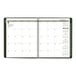 A white and green At-A-Glance monthly planner with calendar pages and numbers in black.