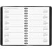 A spiral bound At-A-Glance planner with a black cover and white calendar pages.