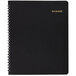 An At-A-Glance black monthly business planner with spiral binding and gold writing on the cover.